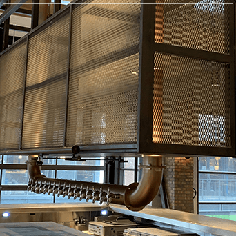 Bronze Draft Beer towers hanging from the ceiling.