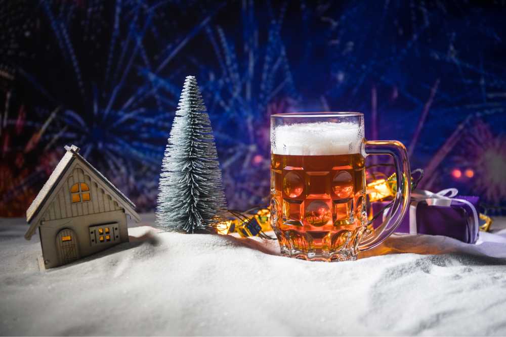 A pint of Christmas ale placed into a winter themed photo shoot set.